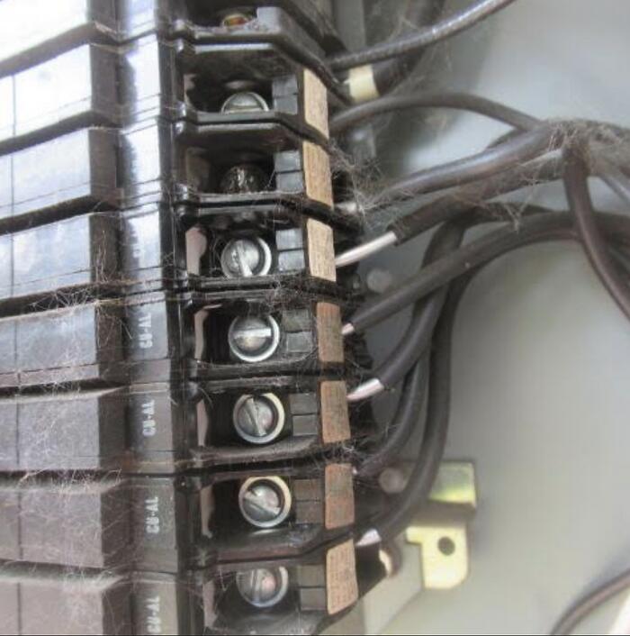 Aluminium wiring connected to a copper-rated device without the correct connector, a common finding in 1960s and 1970s homes in Southern New Brunswick