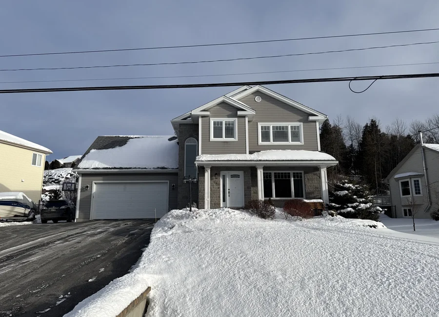 Winter residential home inspection in Quispamsis New Brunswick exterior view two-storey house